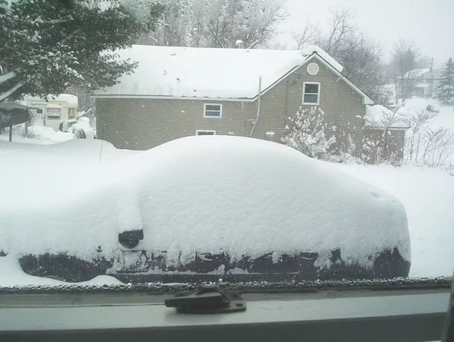 Buried car in snow.